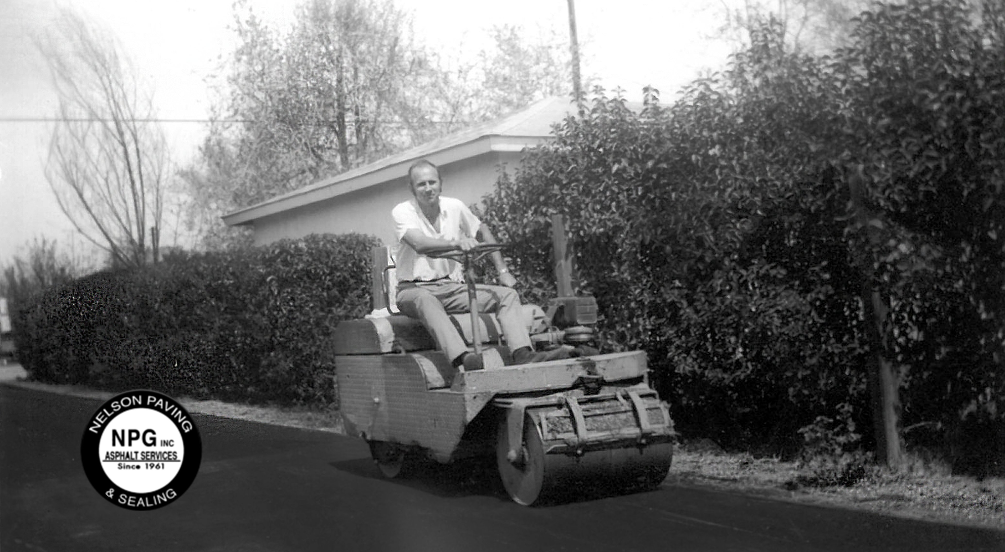 Founder Jewell Nelson on an early asphalt roller — NPG Asphalt 1961